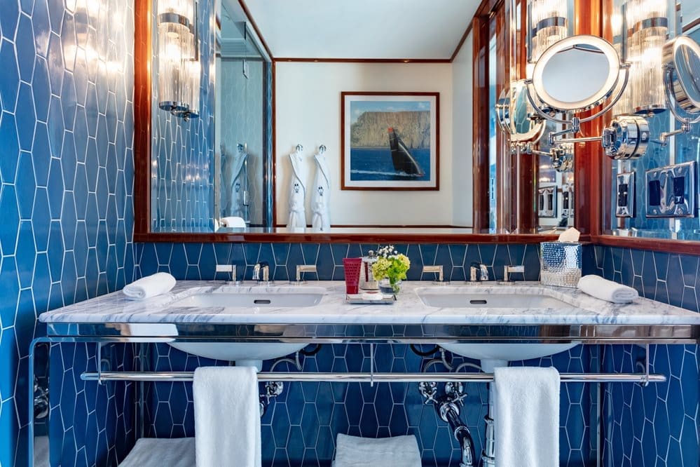 internal shot superior courtyard bathroom with sinks and mirrors